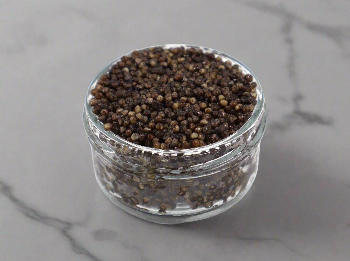 Siberian Caviar – large, smooth sturgeon roe with a buttery, clean flavor. Dark gray to black pearls, perfect for gourmet dining and fine cuisine. Buy premium Siberian Caviar online.